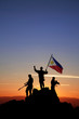 Three armed soldiers with the Philippine flag