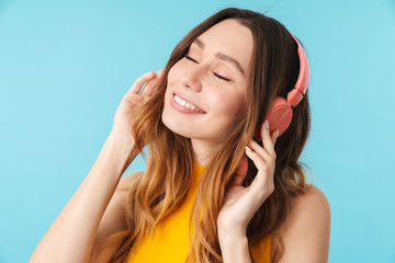 Poster - Portrait of beautiful joyous woman wearing headphones listening to music