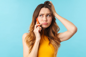 Poster - Portrait of young caucasian woman stressing out while talking on cellphone