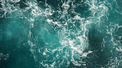  Background of the sea, clean deep ocean with air bubbles, foam on the surface of the ocean. foam composition on blue turquoise water.