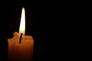 Candle black background of mourning funeral moment of silence	