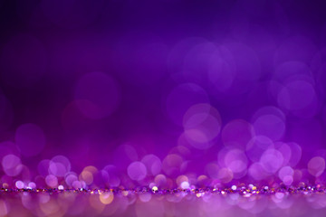 Decoration twinkle lights background, abstract blurred backdrop with circles,modern design wallpaper with sparkling glimmers. Purple, blue and golden backdrop glittering sparks with blur effect