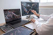 © Ngampol - Stock exchange market concept, Business investor trading or stock brokers having a planning and analyzing with display screen and pointing on the data presented and deal on a stock exchange