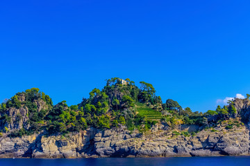 Wall Mural - Old medieval castle, located on a hill near harbor of Portofino town, Italy