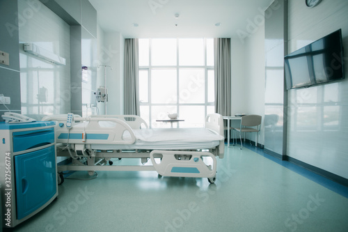 Recovery Room with beds and comfortable medical. Interior of an empty hospital room. Clean and empty room with a bed in the new medical center