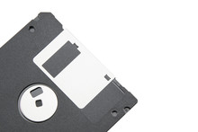 Part Of An Old Black Floppy Disk For An FDD Drive. Digital Vintage Drive. 1.44 Megabyte Retro Data Warehouse. Diskette On A White Isolated Background. Good Quality Close-up.