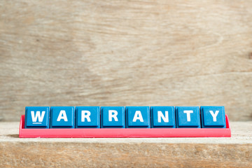 Poster - Tile letter on red rack in word warranty on wood background