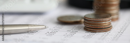 Fotomural Silver pen lying over financial statistics paper with set of numbers
