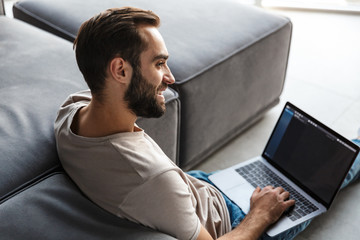 Poster - Optimistic young man indoors at home