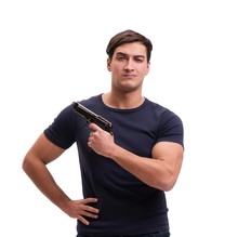 Aggressive Young Man With Gun Isolated On White