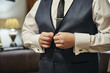© bondvit - Businessman wears a jacket,male hands closeup,groom getting ready in the morning before wedding ceremony