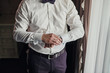© bondvit - businessman checking time on his wrist watch, man putting clock on hand,groom getting ready in the morning before wedding ceremony. Men Fashion