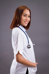 portrait of smiling asian woman doctor isolated, confident and friendly female doctor