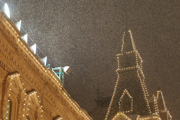 Sticker - Bright illuminated facade of the GUM (Central Department store) in Moscow. Lighting of the Red Square during blizzard in Februay.