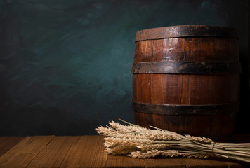 Wall Mural - Glass beer with hop cones and wheat ears on dark wooden background. Beer brewery concept. Beer background. top view with copy space