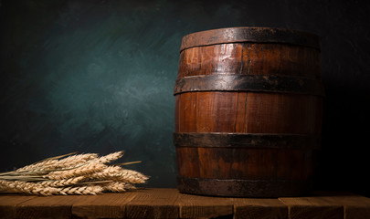 Wall Mural - Glass beer with hop cones and wheat ears on dark wooden background. Beer brewery concept. Beer background. top view with copy space