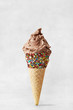 Ice cream cone isolated on a neutral grey background. Copy space