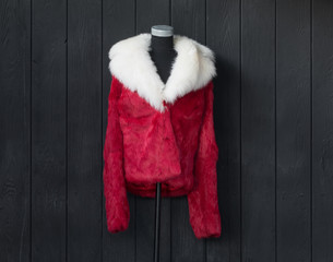 Wall Mural - red fur coat on a mannequin