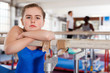 © JackF - Portrait of sad teenage girl in gymnastic swimsuit near sports equipment in gym