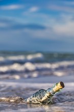  Bottle Message On The Shore Line On The Baltic Sea - Old Glass Bottle With A Message On The Beach 