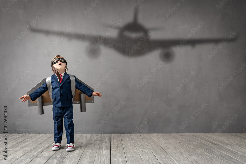 Child dreams of becoming a pilot - obrazy, fototapety, plakaty 