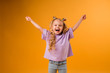 © КРИСТИНА Игумнова - portrait of a happy child girl isolate on a yellow background, space for text