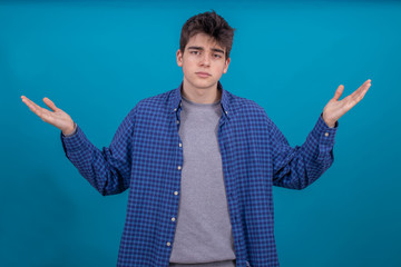 Poster - portrait of young casual man or student isolated on color background