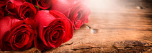 Red Roses On Vintage Old Wooden Board.  Valentines Day Web Wide Rose Banner