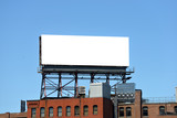 Fototapeta  - Large Billboard On Roof Top Of Brick Building
