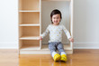 Portrait of Little Girl In Wooden Shelf 