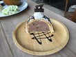 © sutthiporn - Chocolate ice cream cake placed on a wooden plate