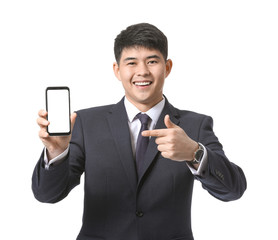 Poster - Young Asian businessman with mobile phone on white background