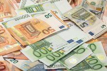 Background Of Dollar, Euro Banknotes On A Table