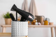 © Pixel-Shot - Modern blow dryer and hairdresser tools in salon