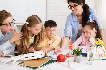 Poster - Stem education. Children studying at robotic class, making notes