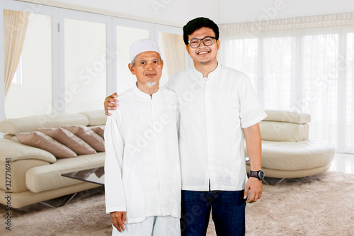 Fotomural Family photo of father and son during Eid Mubarak celebration