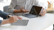 © bongkarn - Cropped shot of two businessman consulting on their work with digital tablets