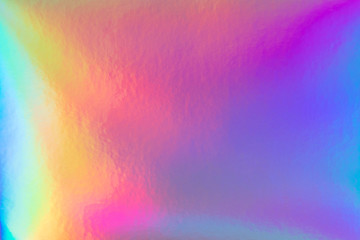 Wall Mural - Abstract trendy rainbow holographic background in 80s style. Blurred texture in violet, pink and mint colors with scratches and irregularities. Bright neon colors.