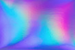 Abstract trendy rainbow holographic background in 80s style. Blurred texture in violet, pink and mint colors with scratches and irregularities. Bright neon colors.