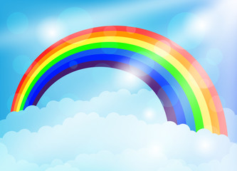 Wall Mural - Bright rainbow and clouds in the blue sky.
