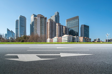 Qingdao urban skyline and asphalt road architectural landscape..