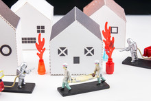 Toys Staff Are Fighting Fire, House Fires And Rescue House Models Isolated On A White Background.