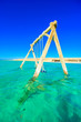 Swing in crystal clear azure water - Orange Bay Beach with white beach - paradise coastline of Giftun island, Mahmya, Hurghada, Red Sea, Egypt