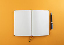 Open Diary Or Notebook With Blank White Pages On Orange Background Template