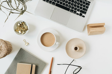 Wall Mural - Home office desk workspace with laptop, coffee cup, notebook, glasses, pen, green plant branch on white background. Flat lay, top view girl boss work business concept for lifestyle blog, social media.