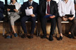© New Africa - People waiting for job interview in office hall, closeup