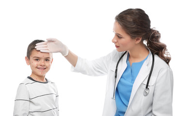 Wall Mural - Doctor examining little boy with chickenpox on white background. Varicella zoster virus