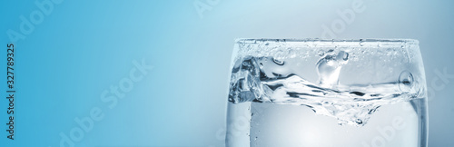 Fotografía Pour drinking water into the glass with copy space