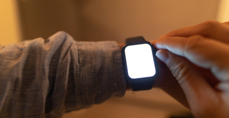 Close up of Businessman's hand looking at hand watch