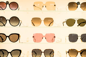 Fashion sunglasses in shop. Close up view